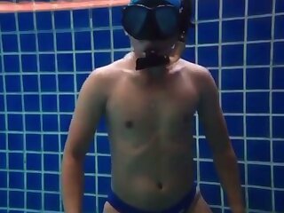 Man breath holds in speedo and snorkel gear