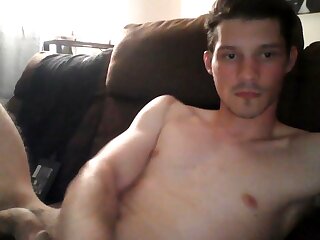 He jerks off his cock until cumming thick loads on his stomach